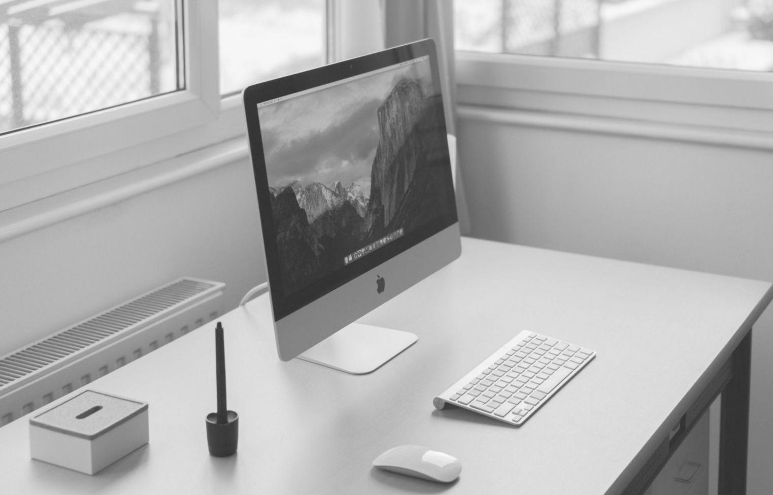 Modern office setup showing webinar registration process and planning materials